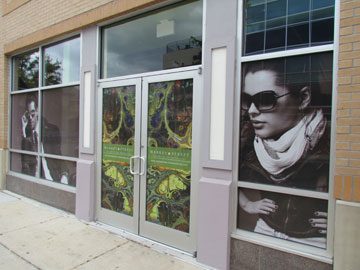One-way visibility graphics for store windows, see-through window graphics